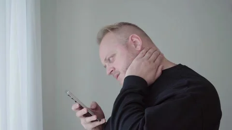 Slouched Neck Posture While Staring Down at Mobile Screen Stock Footage 342053242