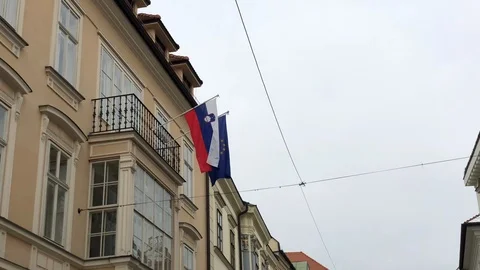 Slovak and EU flags waving in the wind on the building in Bratislava Stock Footage 86303864