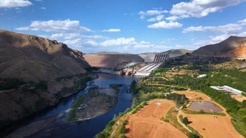 Slow Aerial Approach Toward Massive Hydroelectric Dam Stock Footage 340237605