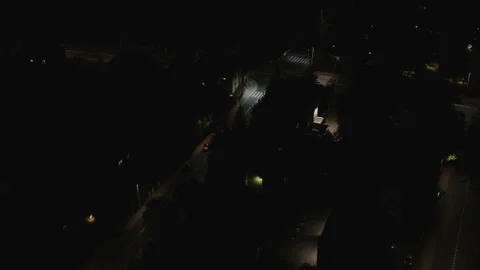 Slow Aerial Dolly Forward Over Quiet Night City Street Stock Footage 323768837