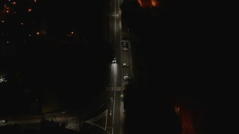 Slow Aerial Drone Flight Towards Approaching Car at Night Video stock 323769081