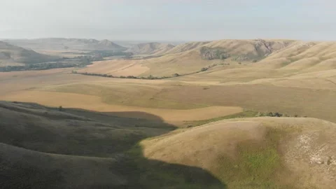 Slow aerial flight backwards over bald steppe mountains. Orenberg, South Ural Video stock 155998713