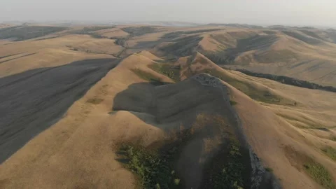 Slow aerial flight backwards over bald steppe mountains. Orenberg, South Ural Video stock 155998835