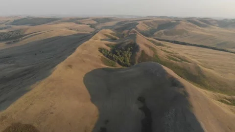 Slow aerial flight backwards over bald steppe mountains. Orenberg, South Ural Video stock 155998855