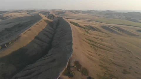 Slow aerial flight backwards over bald steppe mountains. Orenberg, South Ural 動画素材 155998921