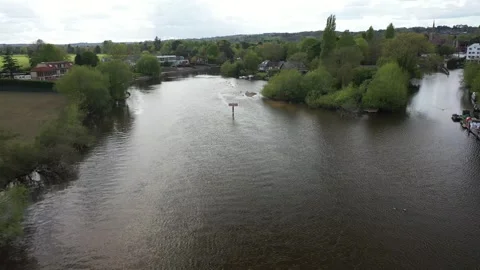 Slow aerial flight forward over the River Thames, approaching a "DANGER" Stock Footage 308418811