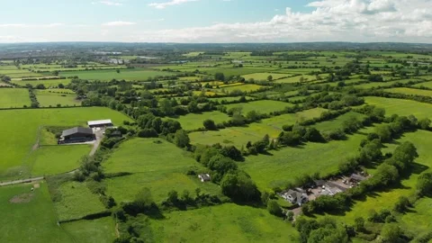 A slow aerial flight over the patchwork of fields in Wiltshire UK Video stock 196897056