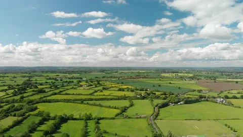 A slow aerial flight over the patchwork of fields in Wiltshire UK Video stock 196897432