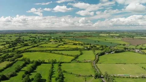 A slow aerial flight over the patchwork of fields in Wiltshire UK Video stock 196897555