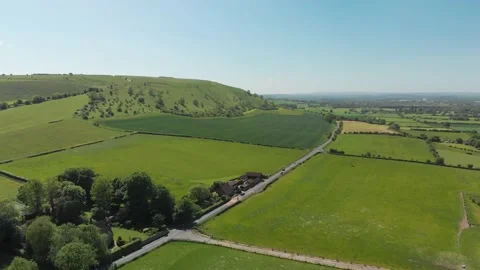 A slow aerial flight over the patchwork of fields in Wiltshire UK Video stock 196898240