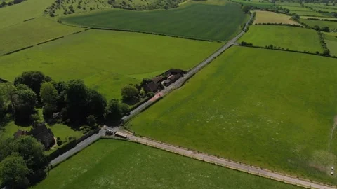 A slow aerial flight over the patchwork of fields in Wiltshire UK Video stock 196898815