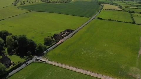 A slow aerial flight over the patchwork of fields in Wiltshire UK Video stock 196898999