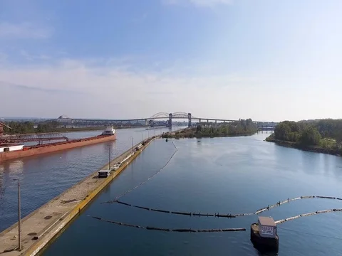Slow aerial flight over Soo locks on St Marys River in Sault Ste Marie, Michigan Stock Footage 80896220