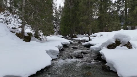 Slow aerial fly forward over mountain stream, Lengau, Saalbach Austria, 4K 60fps Vídeos de archivo 329933202
