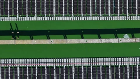 Slow aerial glide above floating solar arrays, advanced water energy systems Stock-Footage 341522570