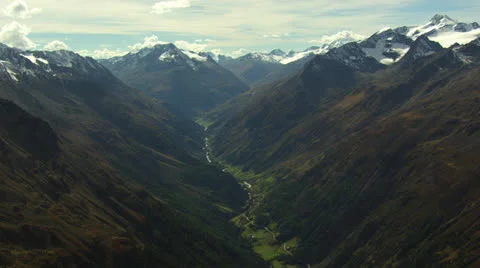 Slow aerial landscape shot of valley with mountains, very high, Tyrol / Austria Stock Footage