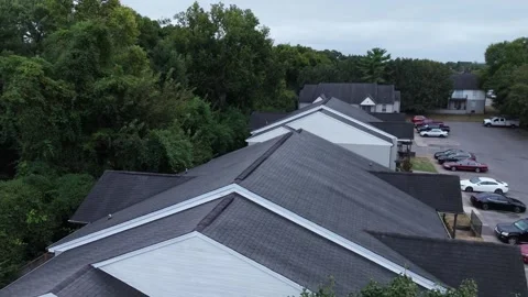 Slow aerial lateral pass along suburban apartment buildings Stock Footage 346732151