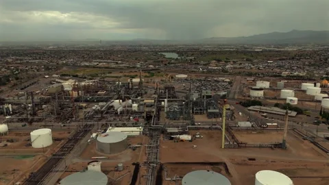 Slow Aerial Orbit Around Large Oil Refinery and Storage Tanks Stock Footage 334953010