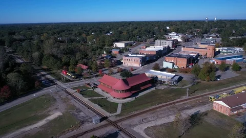 Slow aerial orbit around the Old Train depot Stock Footage 119705747