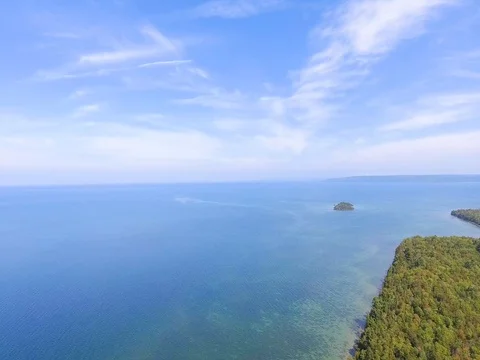 Slow Aerial orbit over crystal clear Lake Michigan Stock Footage 80896072
