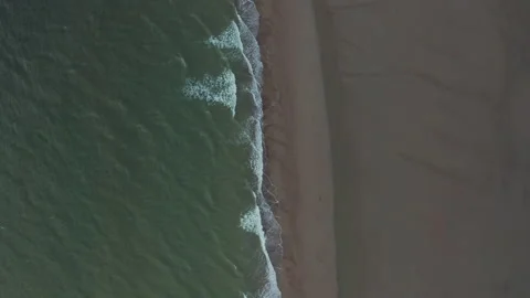Slow Aerial Overhead Top Down Birds Eye View of Green Ocean Water and Brown Video stock 139691523