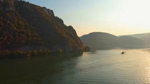 Slow Aerial Pan over empty Danube river delta with one single Cargo Ship Stock Footage 119913543