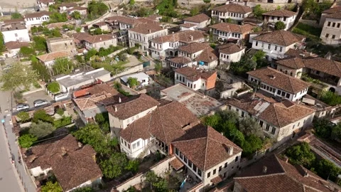 Slow Aerial Pull-Away Flight Over Historic Red Tile Roofs in Berat Stock-Footage 335486607