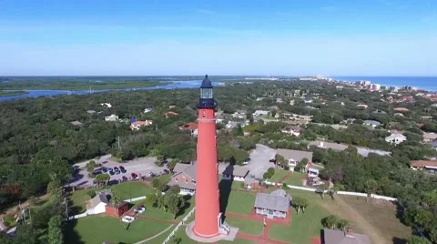 Slow aerial pull back video of the Ponce Inlet inlet lighthouse Video stock 62471472