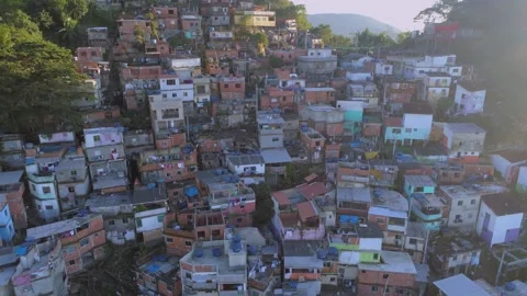 Slow aerial pullback from colourful favela houses in Rio de Janeiro, Brazil 스톡 동영상 251050586