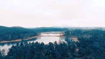 Slow aerial shot of a lake port in winter Stock Footage