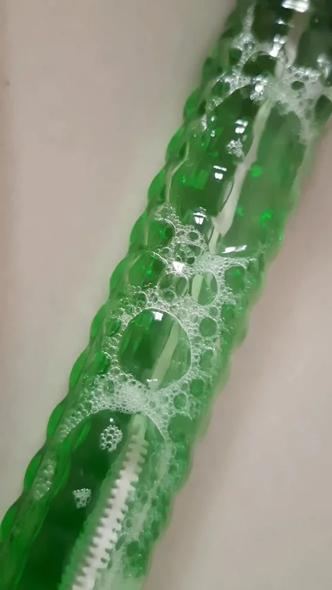 Slow Air Bubble Movement Through Green Liquid Stock Footage 342939096