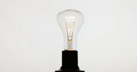 Slow and very bright ignition and dimming of an electric bulb Stock Footage 288450766