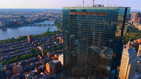 Slow approach to the dark glossy high-rise reflecting the cityscape. Beautiful Stock Footage 340476995