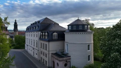 Slow approach to Weimar palace tower and equestrian monument at dawn Stock Footage 335396901