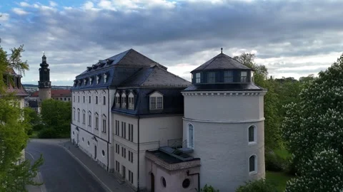 Slow approach to Weimar palace tower and equestrian monument at dawn Stock Footage 340925411