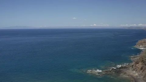 Slow arial pan across ocean side resort Stock Footage 103344943