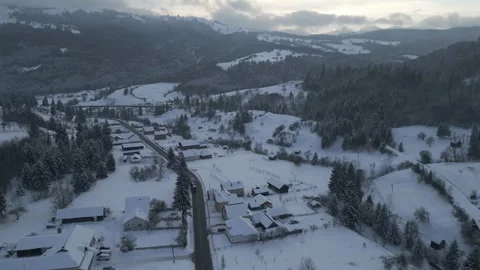Slow ascending drone flight over snowy mountain village Stock Footage 341765244