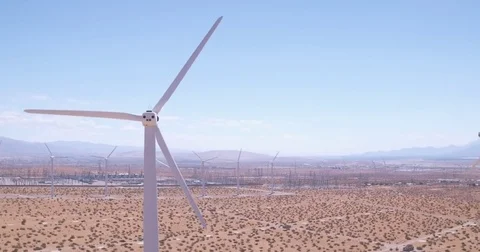 Slow Ascending Shot of Windmill Spinning In the Desert. Video stock 79178993
