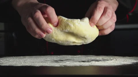 SLOW: Baker throws up a dough on a table in kitchen Vídeo Stock 62900312