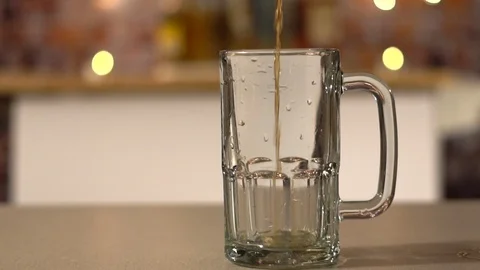 Slow beer pour into a mug Stock Footage 102683482