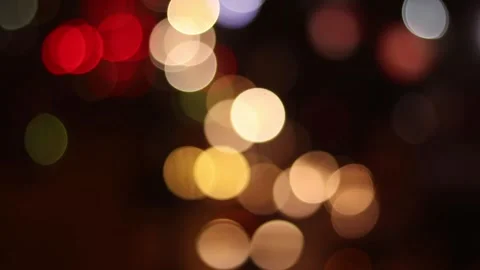 Slow Bokeh Moving in a Direction with Dark Background Stockbeeldmateriaal 153265836