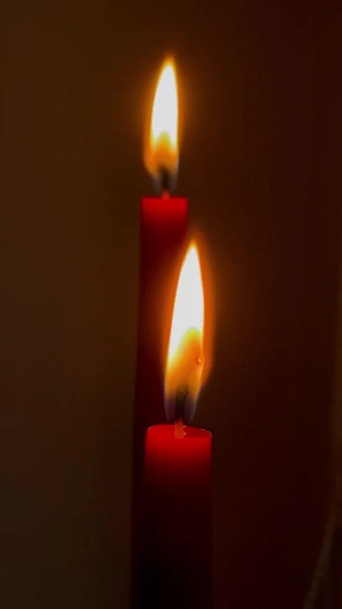 Slow burning of red candles up close Stock Footage 304611435
