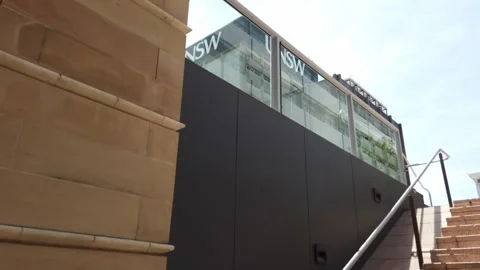 Slow camera motion up some stairs to reveal the Main Library Building Stock Footage 257892507