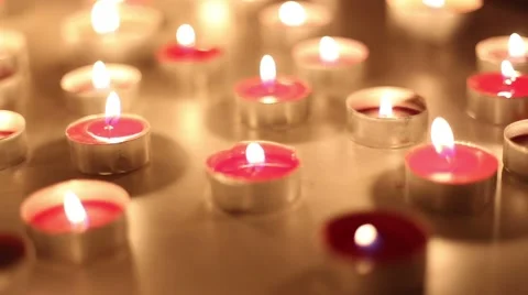 Slow camera move over moody red candles  Stockbeeldmateriaal 42254097