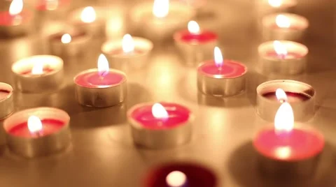 Slow camera move over moody red candles  Stockbeeldmateriaal 42544828