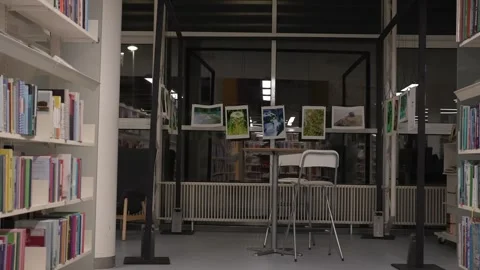 Slow camera movement between two archive shelves filled with folders. Stock Footage 252452879