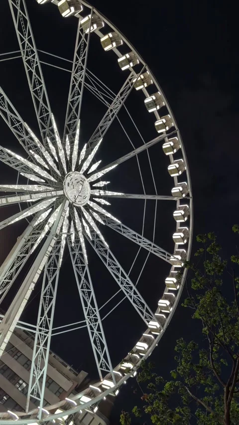 Slow camera pan across the Budapest Ferris Wheel at night Stock Footage 340555173