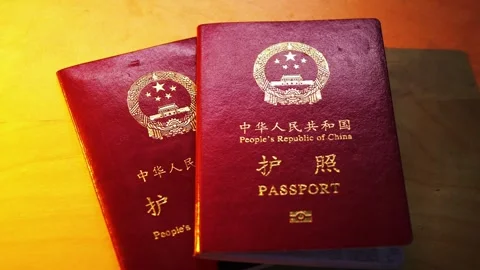 Slow camera pan across the official PRC passport cover details. Stock Footage 321636030