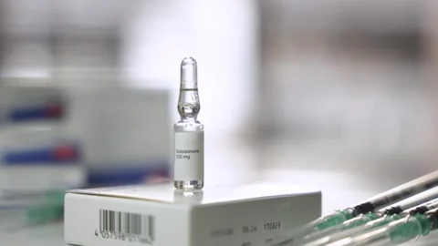 Slow Camera Pull Back of Testosterone Ampoule with Syringes Stock Footage 327477407