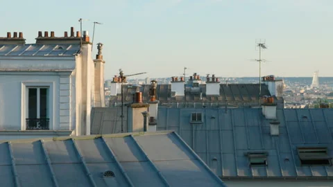 A slow camera tilt up showcasing the classic gray zinc rooftops, clay chimneys,  Stock Footage 337414092